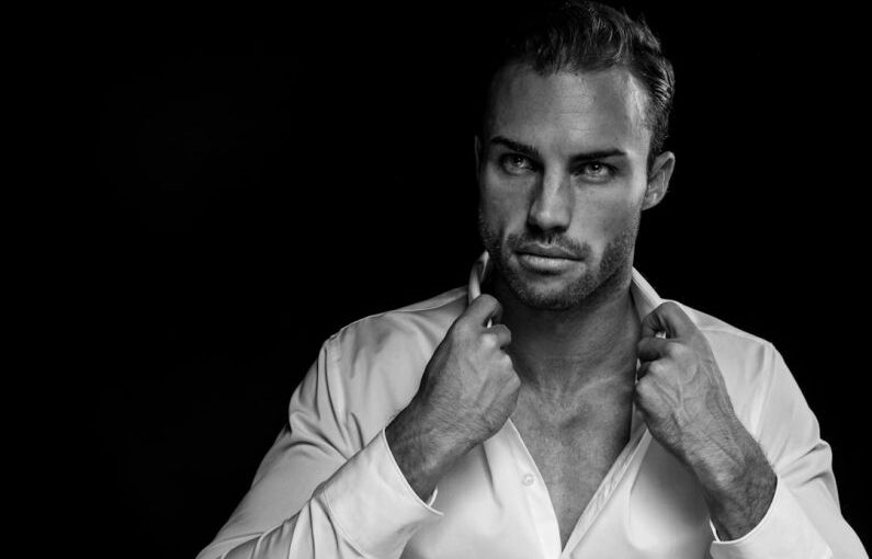 Men Grooming - grayscale portrait of man wearing white dress shirt on black background
