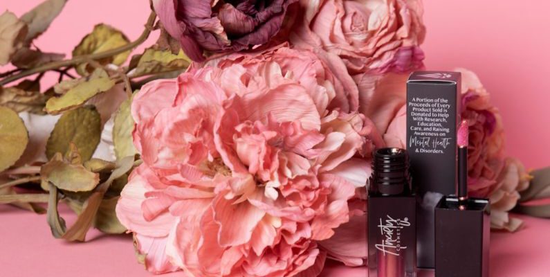 CBD Beauty - a pink flower and lipstick on a pink background