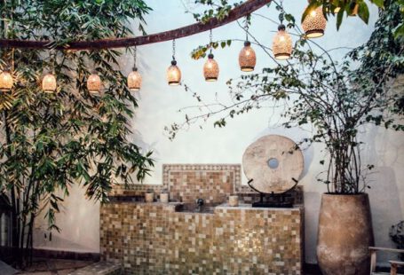 Luxury Authentication - Traditional oriental hammam pool on exotic resort spa terrace decorated with lush plants and stylish lanterns