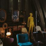 Vintage Decor - gold statue near red chair