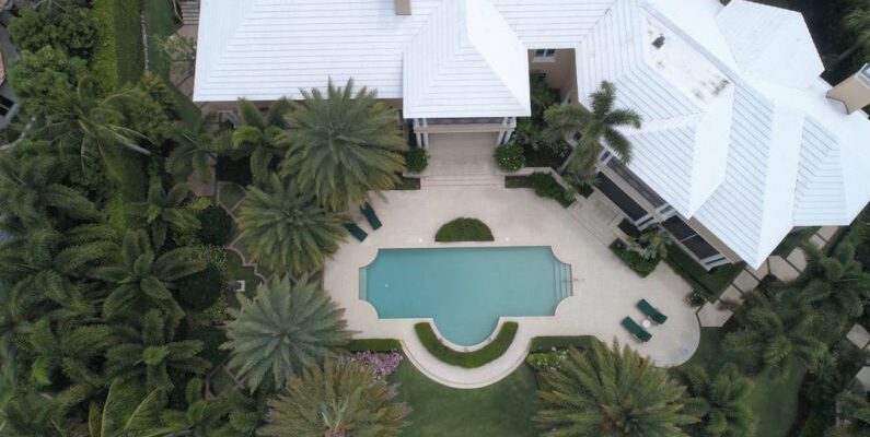 Luxury Value - aerial view photography of white house near swimming pool