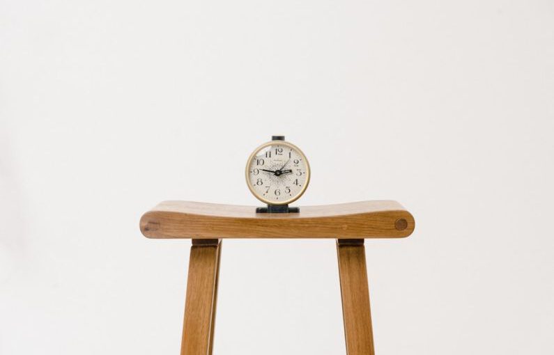 Budget Fashion - brown wooden table clock at 10 10