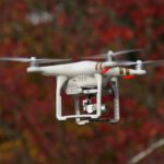 Drone Tech - white and gold DJI Phantom 3 Professional selective focus photography