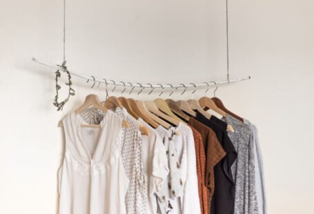 Sustainable Trend - assorted clothes in wooden hangers