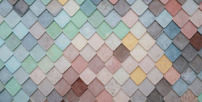 Neutral Colors - a multicolored tile wall with a pattern of small squares